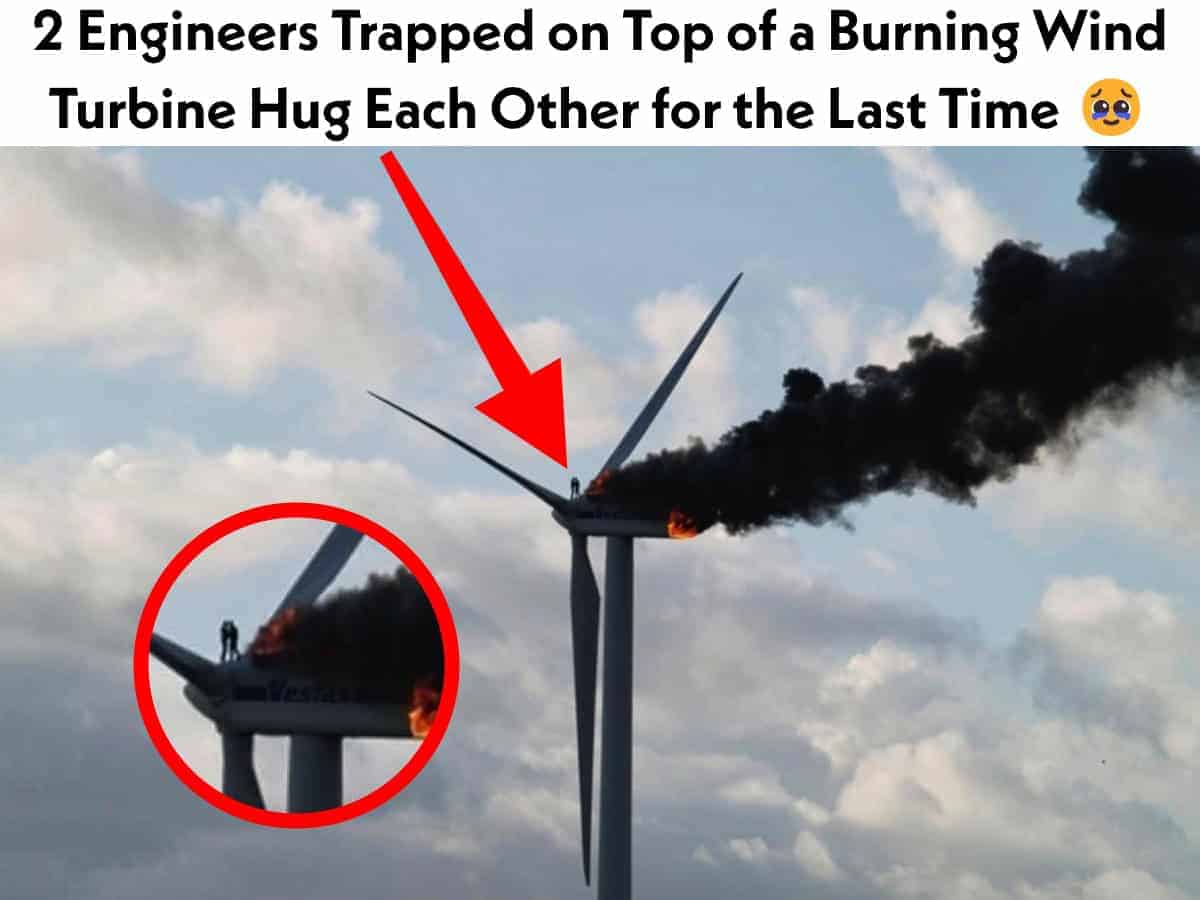 Two Engineer on the Top of Burning Wing Turbine